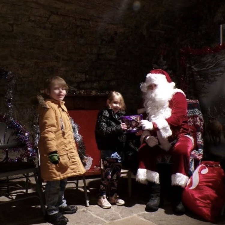 A team member pretending to be Santa